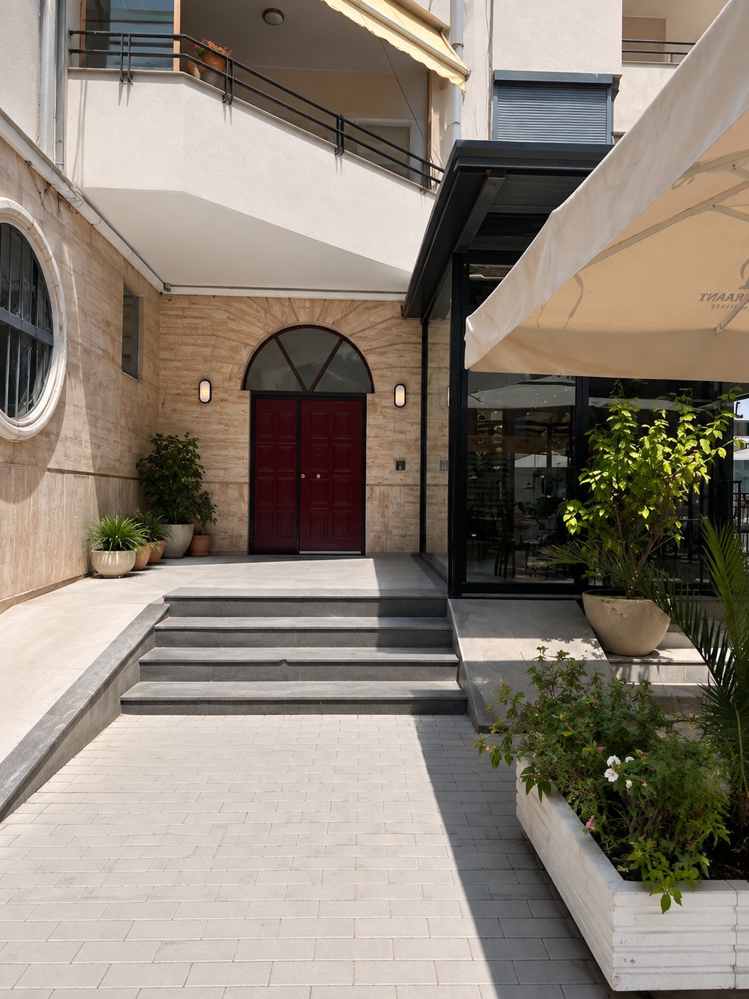 Courtyard with the burgundy double door of the apartment building